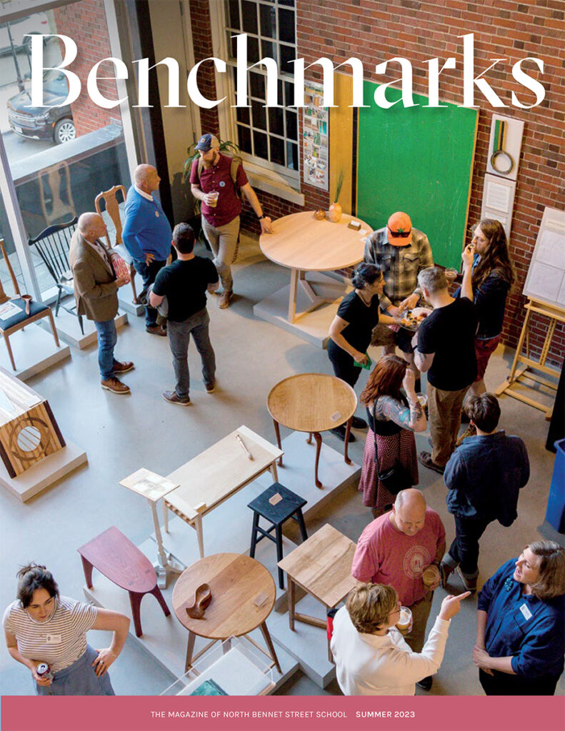 Cover of Benchmarks magazine, showing a group viewing the 2023 Exhibition